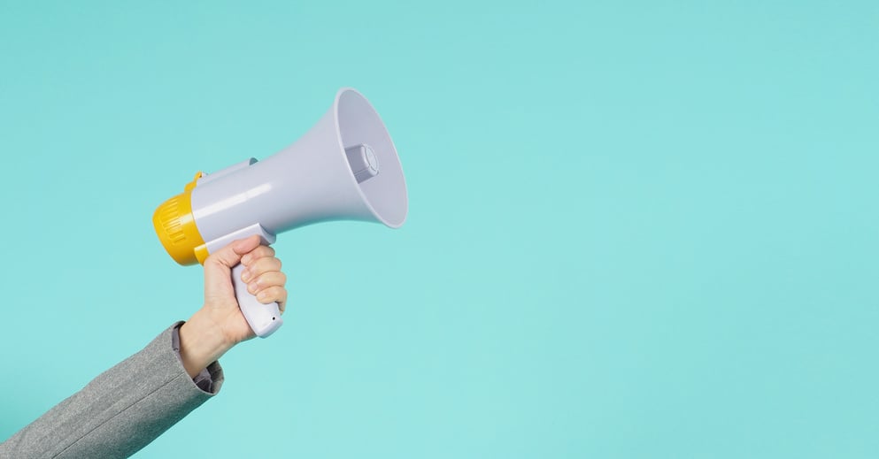 Hand Holding a Megaphone